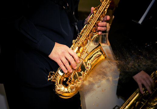 closeup saxophone disperse dust effect player palys his solo  