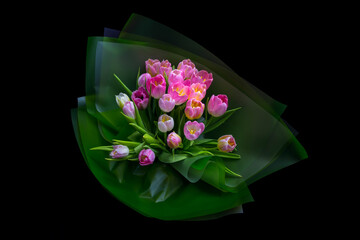 Bouquet of spring tulips on a black background