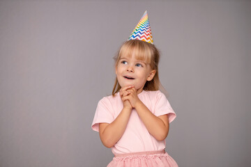 Young beautiful girl in birthday cap over isolated background smiling with happy face