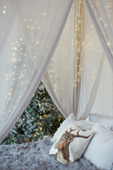 Christmas bedroom canopy with lights © aprilante