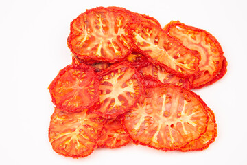 dried tomato slices on white background. Vitamin vegetable food