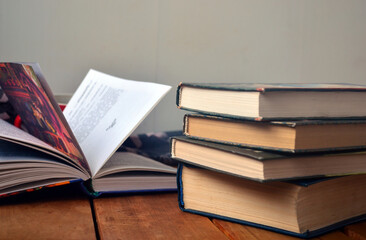 A stack of old books with yellowed pages, textbook, training, encyclopedia. Reading, knowledge. Library.