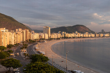 Beautiful sunrise view to buildings on the shore of Copacabana Beach