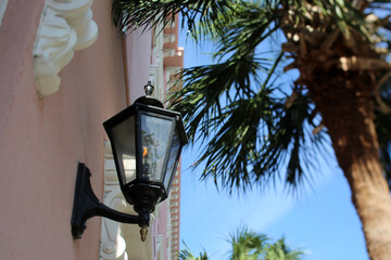 Fototapeta premium Gas Lamp On A Historice Charleston, South Carolina Building