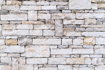 wall texture made of cut stone. stone wall background.