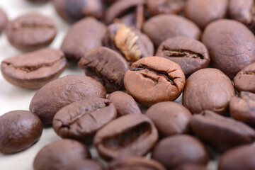 Coffee beans background. Roasted aromatic brown coffee beans close up