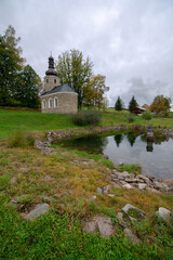 Obraz premium Chapel and lake at Vatetice, Sumava national park, Czech republic
