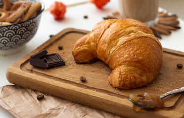 Freshly baked croissant with chocolate close up
