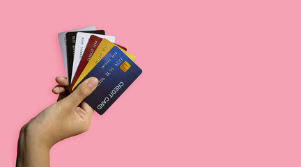 Hands holding plastic credit card and Color background. Online shopping concept. Payment online concept.