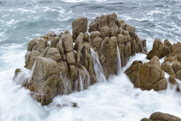waves crashing on rocks