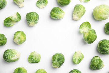 Fresh Brussels sprouts on white background, top view. Space for text