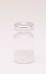 vaccine in glass taro, closed isolated on white background