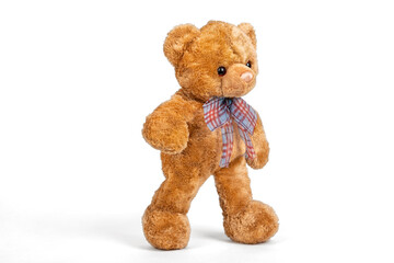 Teddy bear walking on white background.