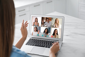 Coworkers working together online. Woman using video chat on laptop, closeup