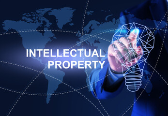 Intellectual property concept. Man using virtual screen with world map and lamp bulb illustrations,...
