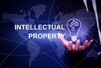 Intellectual property concept. Man with light bulb and world map illustrations, closeup
