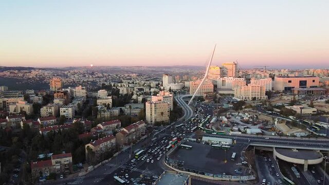 Wide aerial, sunset over Chord Bridge in downtown Jerusalem