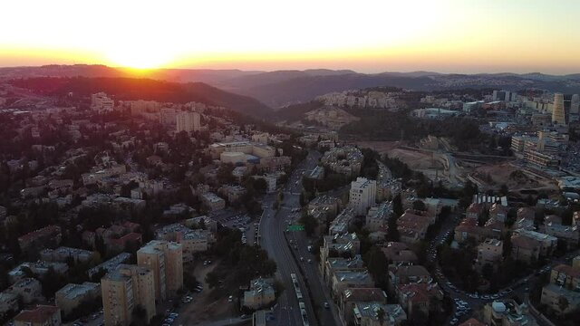 Wide aerial, sunset over Jerusalem