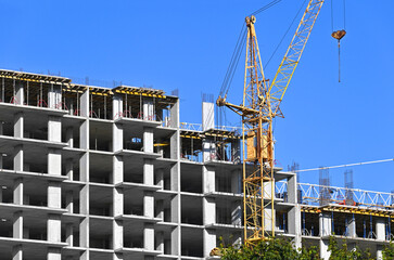 Crane and highrise construction site