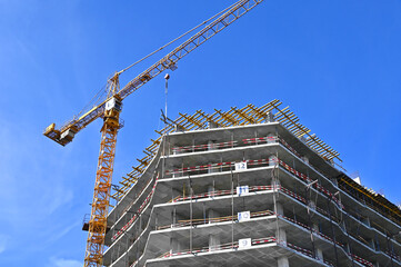 Crane and highrise construction site