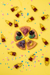 multicolored chewing marmalade. Jelly candies  on a yellow background - 392990027