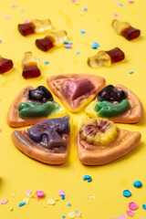 multicolored chewing marmalade. Jelly candies  on a yellow background