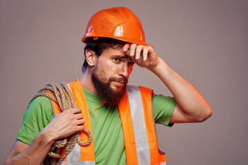man in orange helmet work engineer professional tools