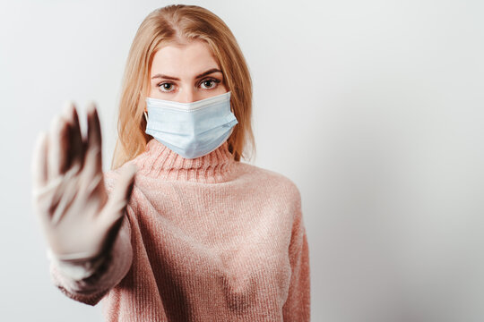 Woman In Protective Face Mask Showing Stop Sign