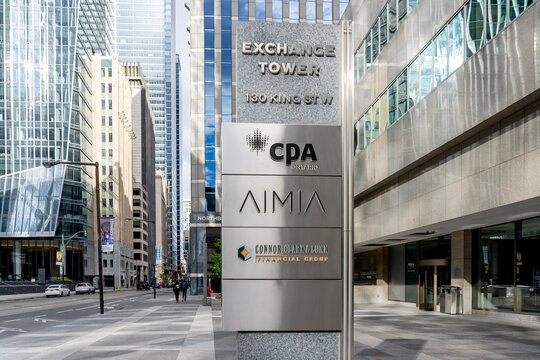 Toronto, Canada-October 24, 2020: CPA Ontario, AIMIA, Connor Clark & Lunn 
signs are seen on an exterior business directory sign outside Exchange Tower building in Toronto, Canada.
