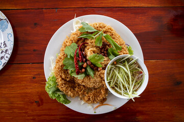 Deep Fried Catfish Salad with Spicy Sour Green Mango Dressing, Yum Pla Dook Fu