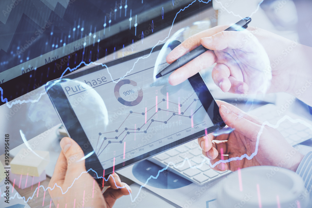 Poster double exposure of man's hands holding and using a phone and financial chart drawing. market analysi