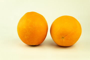 Fresh oranges in a basket on a white background