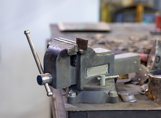 Part of the machine is clamped in a vice