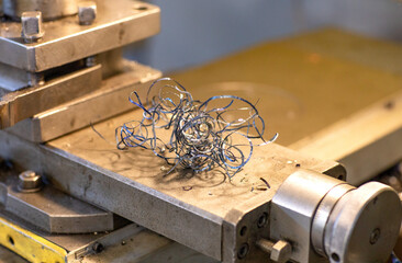 Metal shavings lie on the metal-working machine