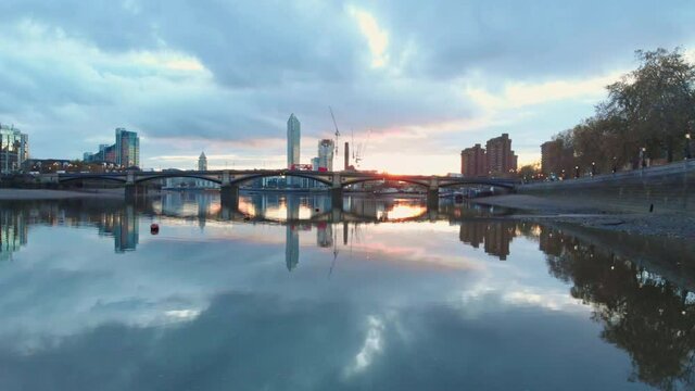 Low slider drone shot of Battersea bridge London at sunset