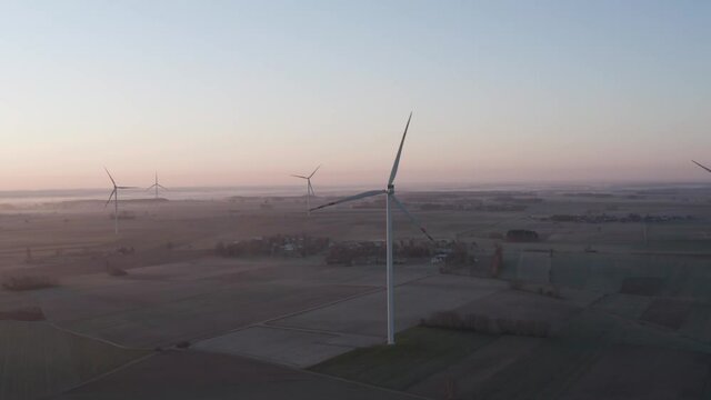 Wind turbine during sunrise in Poland, Europe.