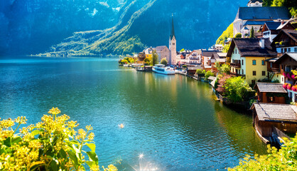 Scenic panoramic view of famous Hallstatt lakeside town reflecting in Hallstättersee lake in the...