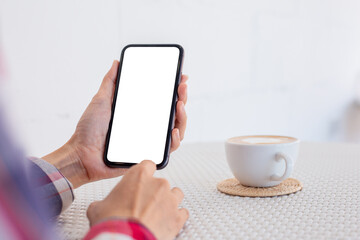 cell phone blank white screen mockup.woman hand holding texting using mobile on desk at office.background empty space for advertise.work people contact marketing business,technology