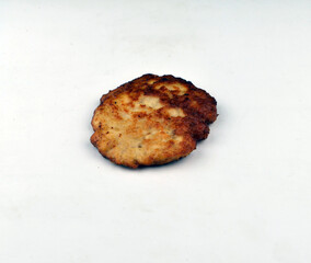 delicious minced meat cutlet lies on a white background
