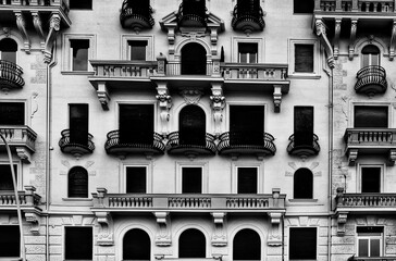 Facade and windows of houses in Naples, Italy.