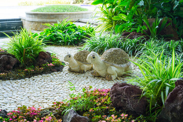 Gravel garden decorated with two turtles pottery white  gravel, brown stone