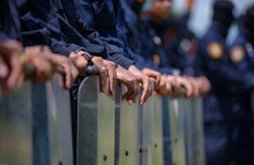 Fototapeta na wymiar Riot police practice shields and baton 