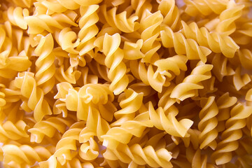 background with raw spiral pasta