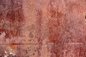 background of rusty metal with a welded seam