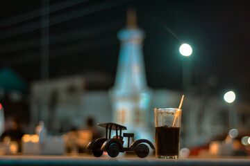 Kopi jos yogyakarta, jos coffee is a typical angkringan drink from yogyakarta with a mixture of charcoal. object coffee with the background of the Jogja monument
