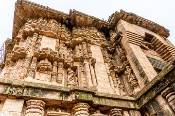 Ancient sandstone carvings on the walls of the ancient sun temple at Konark, India.
