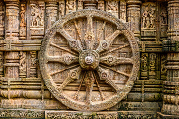 Fototapeta na wymiar Ancient sandstone carvings on the walls of the ancient sun temple at Konark, India. 