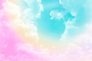 Fototapeta na wymiar Pastel rainbow on white fluffy clouds, colorful blue sky on background