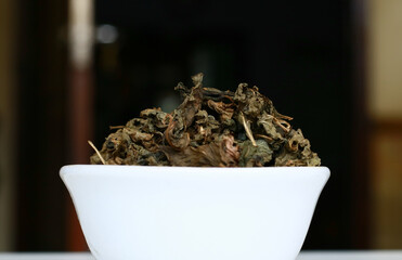 Dried mint leaves on black background.
