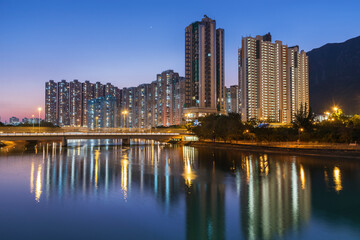 High rise residential building in Hong Kong city at dusk